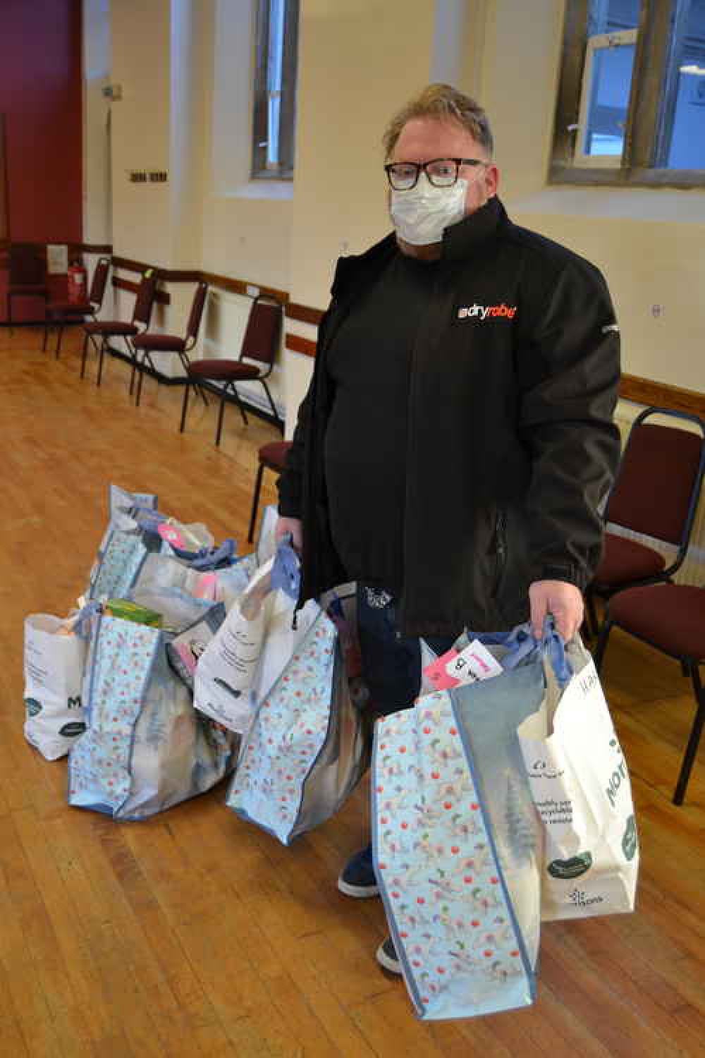 Archie Turner, of Bridport Round Table, delivers some hampers