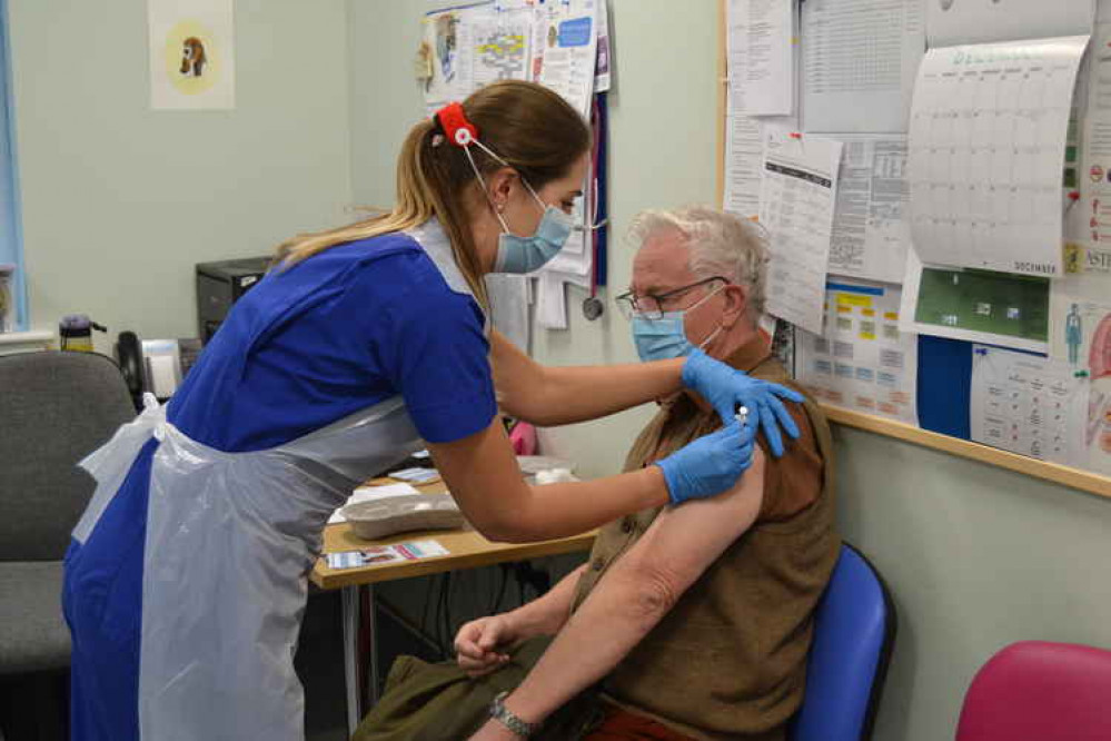 Bridport Medical Centre was one of six GP-led centres in Dorset to administer the first round of Covid-19 vaccines. Pictured; Nigel Whitaker is given the Covid vaccine by Carly Reed at Bridport Medical Centre