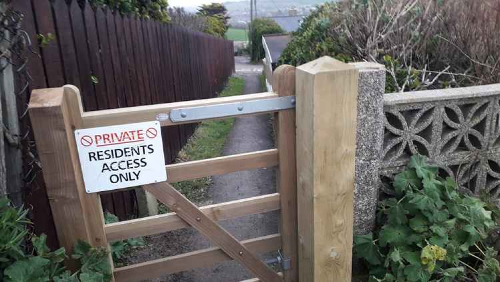 The gate and signage on one of the routes leading into West Cliff The gate and signage on one of the routes leading into West Cliff