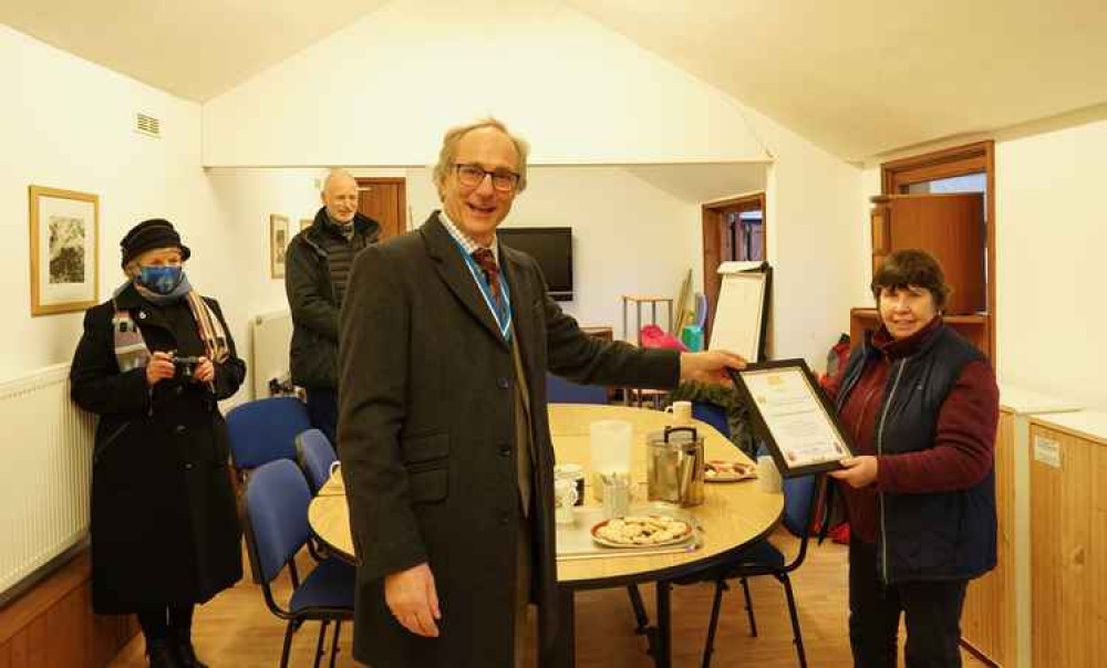 High Sheriff of Dorset, George Streatfeild, presents the team at the Pilsdon Community with a High Sheriff's Award