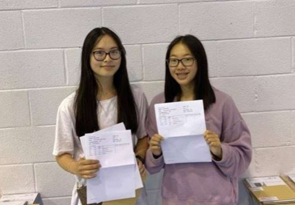 Emma Mao and Wendy Ren of Wirral Grammar School for Girls celebrate their 4 A*s