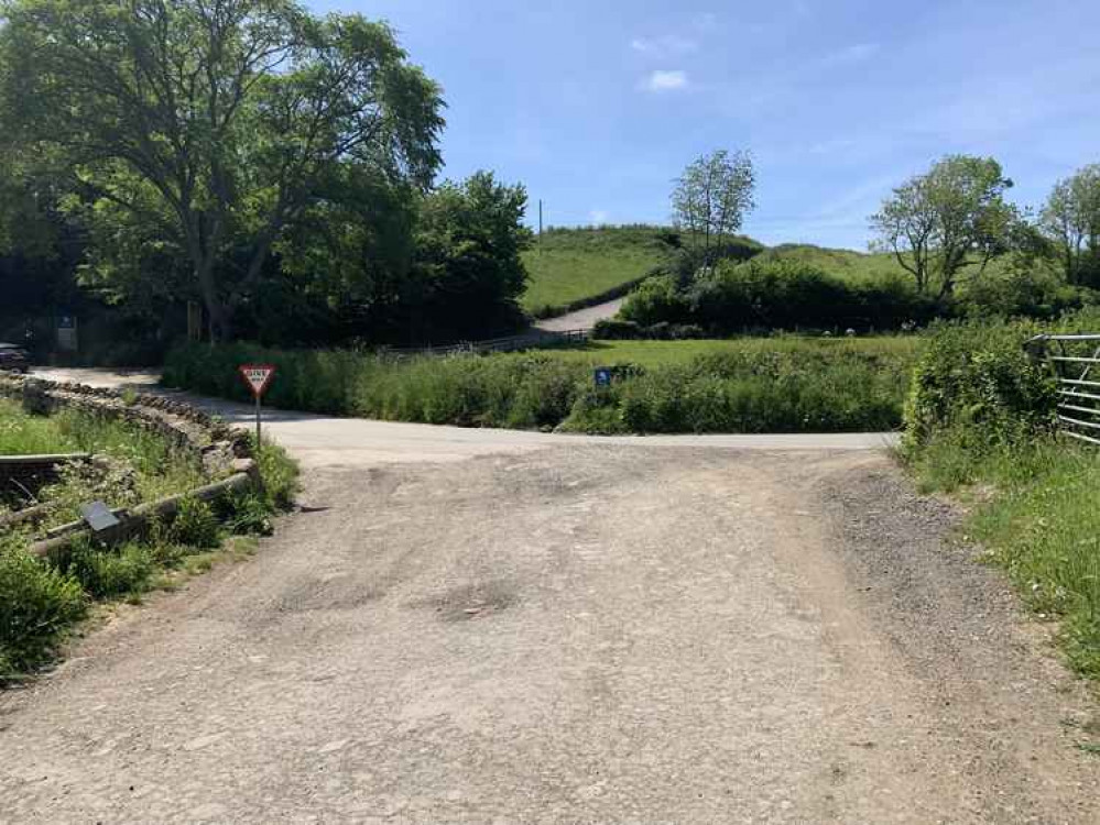 Where the road meets another, turn left and follow it into the centre of Symondsbury