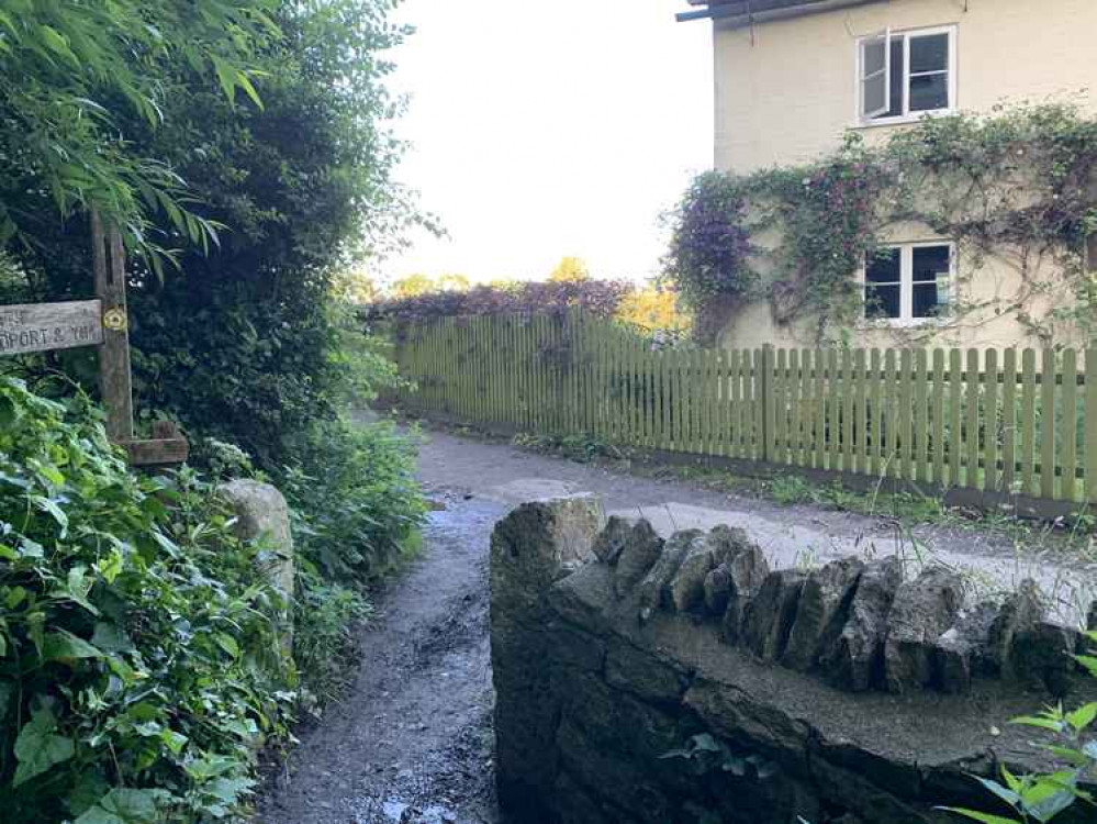 Turn left when the path comes out opposite a house