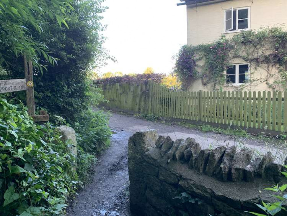 Turn left when the path comes out opposite a house