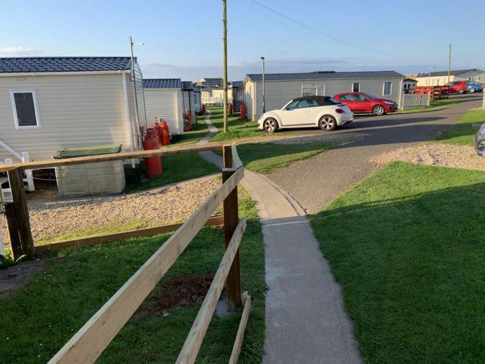 At the caravan park, take the small concrete path between caravans