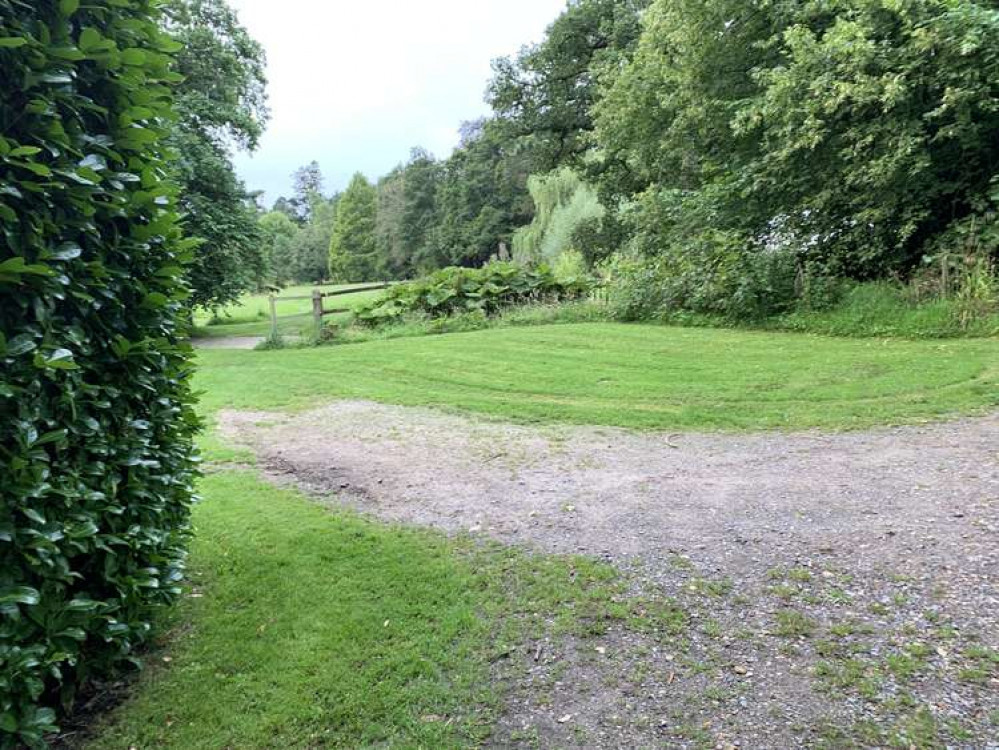 After going across a wooden bridge, turn left to go through a grassy field