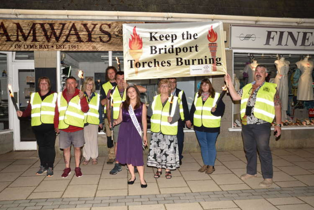 Bridport Carnival Committee and carnival princess walking the torchlight route Picture: Tim Russ