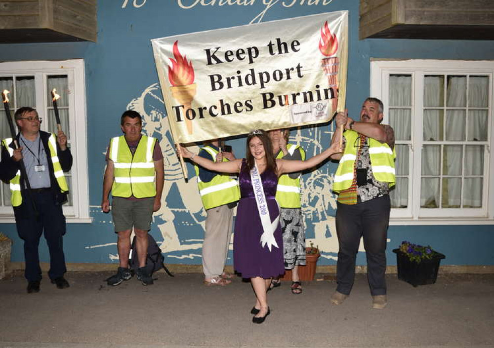 Bridport Carnival Committee and carnival princess walking the torchlight route Picture: Tim Russ