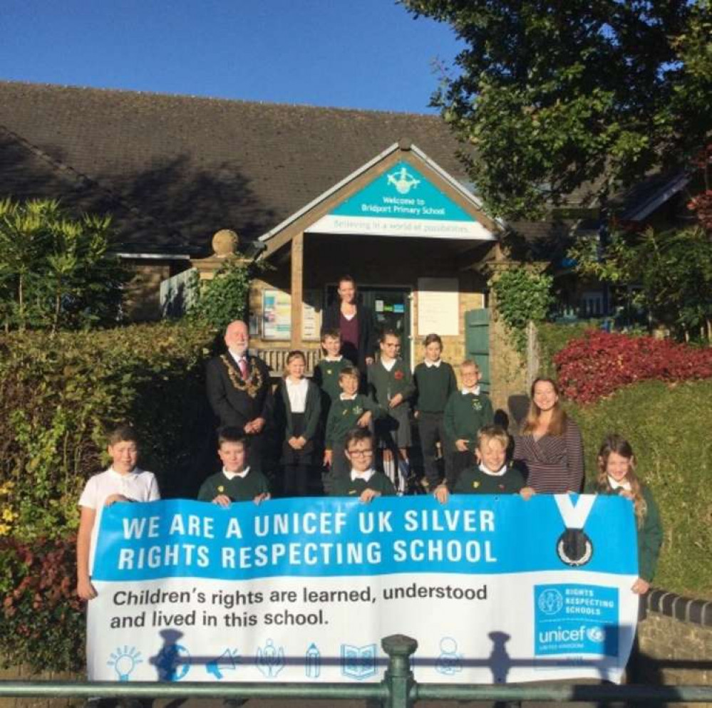 Bridport Primary School receives silver Rights Respecting School accreditation, pictured is Bridport mayor Ian Bark, headteacher Michaela Kite, assistant head Felicity LeGassick and children from the school council, including the Rights Respecting Ambassa