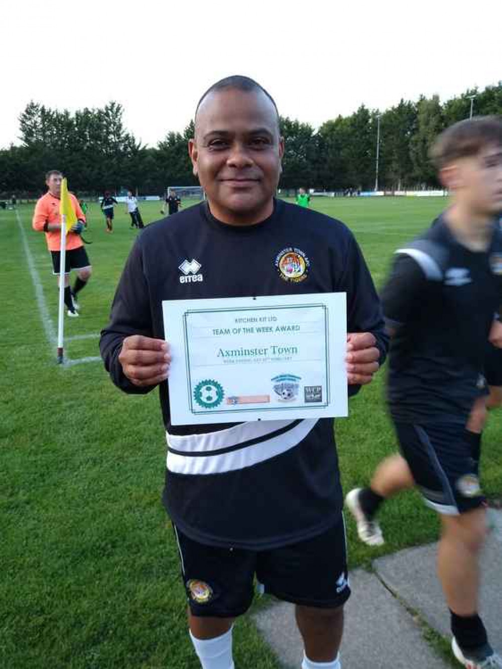 Axminster manager Josh Stunnell was presented with a SWP pre-civid team of the week award before the match at Crediton United. Axminster manager Josh Stunnell was presented with a SWP pre-civid team of the week award before the match at Crediton United.