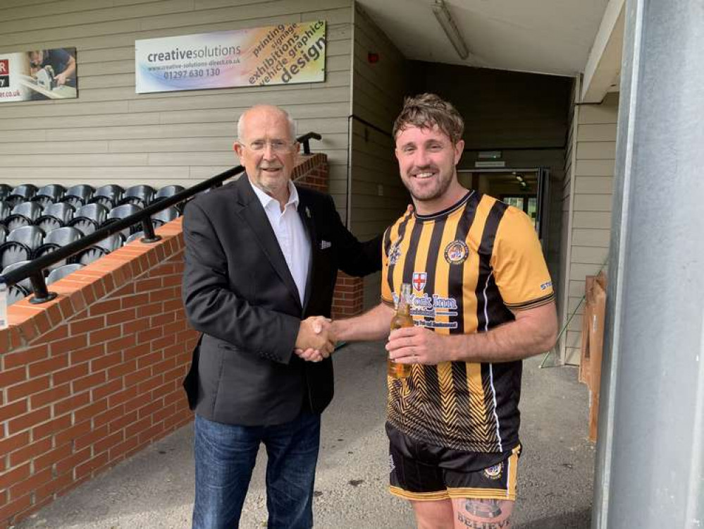 Philip Evans MBE, representing sponsors Axminster Nub News, congratulates Josh Wadham on his man-of-the-match award Philip Evans MBE, representing sponsors Axminster Nub News, congratulates Josh Wadham on his man-of-the-match award