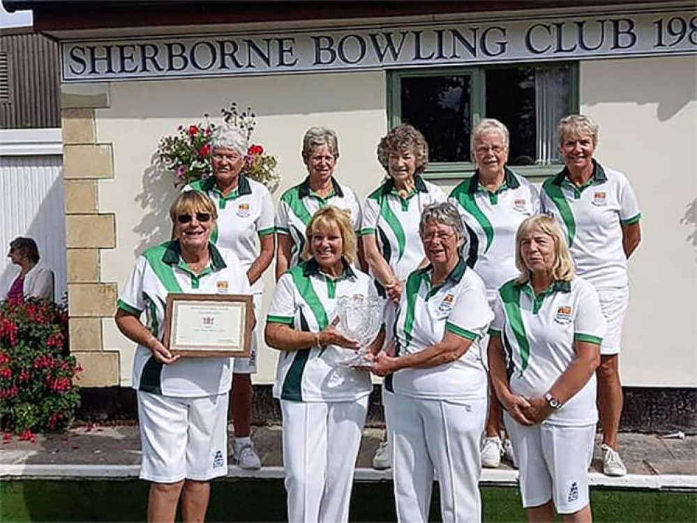 The Lyme Ladies pictured wit their trophy: Ann Allman, Lesley Broom, Nicky Driscoll, Mary Haseman, Chris Pomeroy, Angela Rattenbury, Sue Rowe, Erica Sarson and Pam Weech.