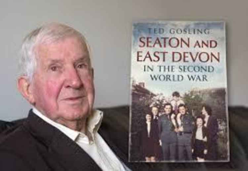 Freeman of the Town Ted Gosling, first in line for a Cover-19 vaccination at Seaton Hospital, pictured with one of his many books on Seaton