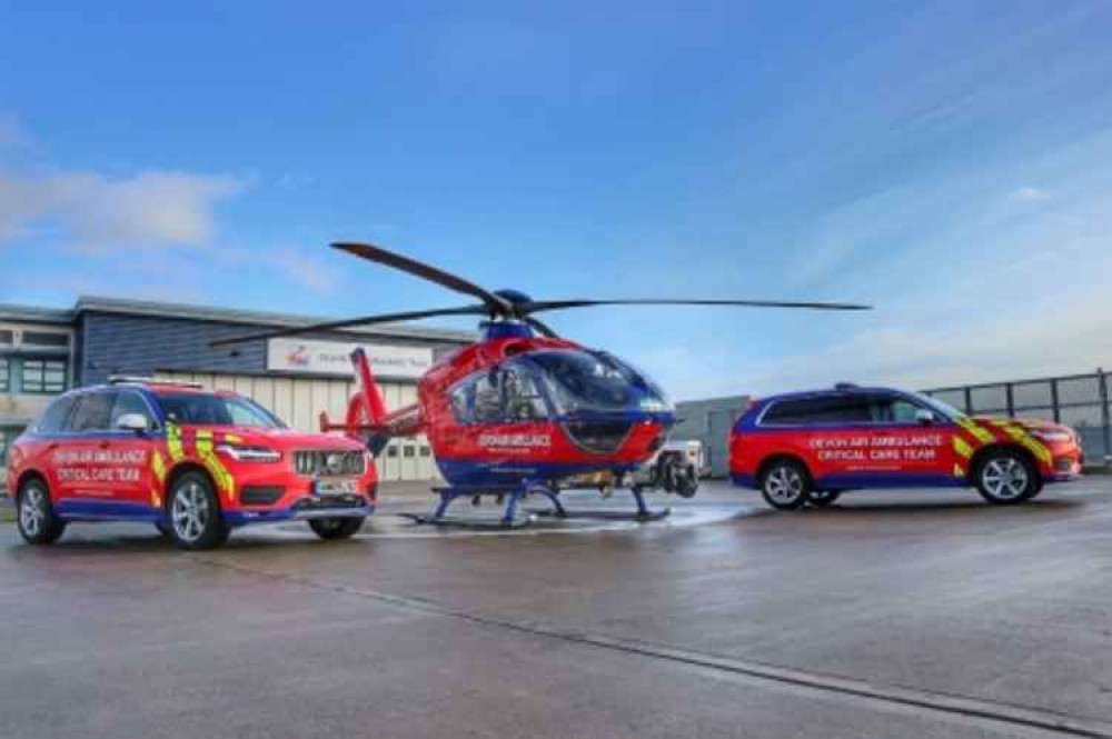 Devon Air Ambulance helicopter with two Critical Care Cars (photo: Devon Air Ambulance)