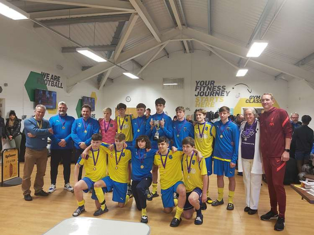 Winners Heswall FC and (right) Pauline Fielding and Chris Kirkland