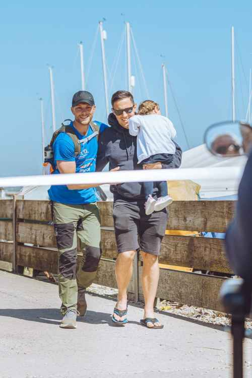 Alex and Mike cross the finishing line together on Seaton seafront Alex and Mike cross the finishing line together on Seaton seafront