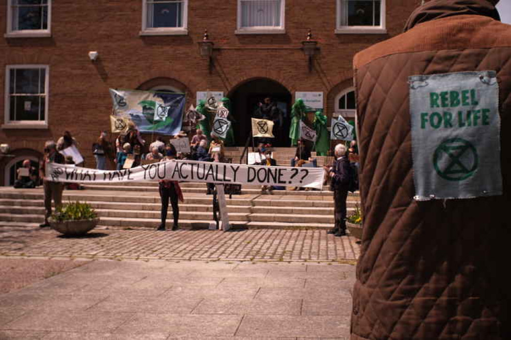 Environmentalists gathered outside Devon County Hall last week for a silent proteat Environmentalists gathered outside Devon County Hall last week for a silent proteat