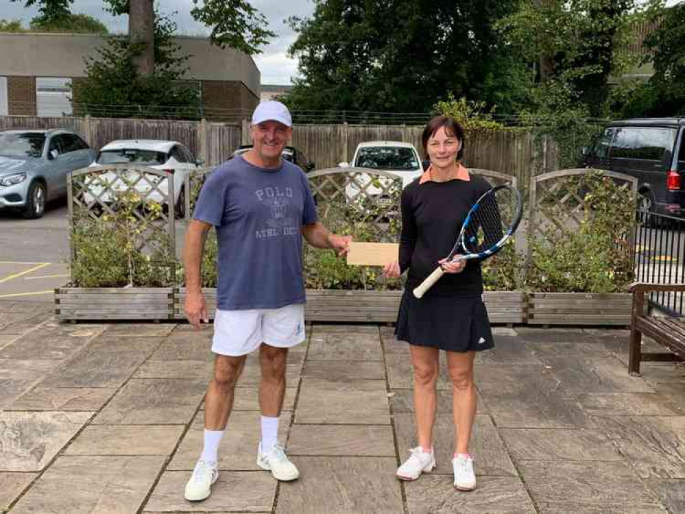 Kim Bennett receives her vouchers from Chris Garside Kim Bennett receives her vouchers from Chris Garside