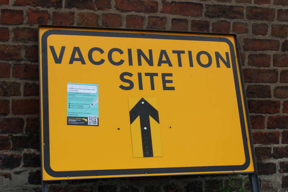 Anti-vaccination poster adorns a vaccination site direction sign at Congleton Museum.