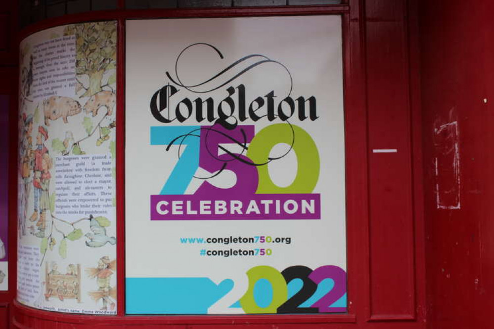 An empty retail unit on Bridge Street promotes Congleton's 750th anniversary.