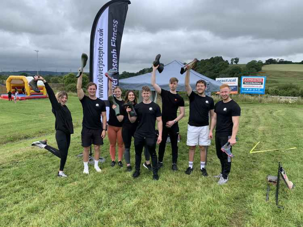 Staff at the Oliver Joseph Fitness gymnasium who ran a welly boot throwing competition at the Axminster Town fun day Staff at the Oliver Joseph Fitness gymnasium who ran a welly boot throwing competition at the Axminster Town fun day