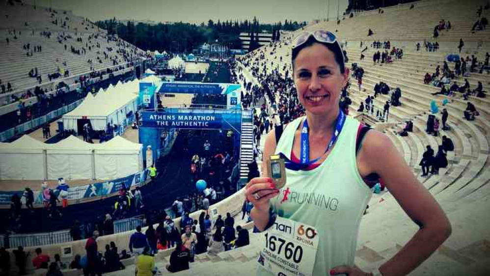 Caroline with her medal after she completed the Athens Marathon in November 2018 Caroline with her medal after she completed the Athens Marathon in November 2018