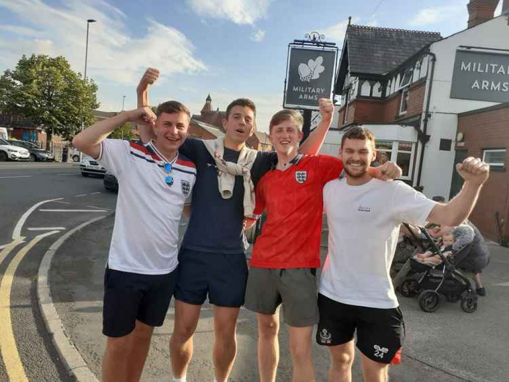 Jake Tew, Kieran Anderson, Fred Dobberson and David Hanson walk into town.