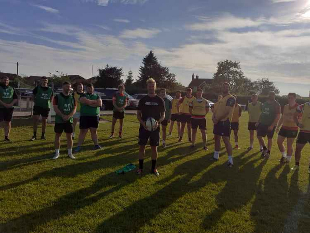 Players with Will at the informal training session