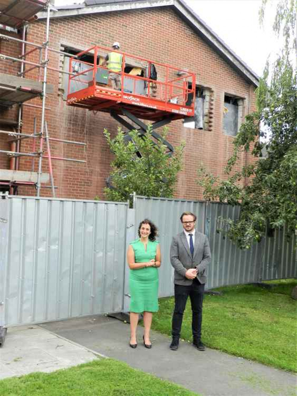 Headteacher Ellen Walton in front of the extension with Dan Massey, Technology Curriculum lead