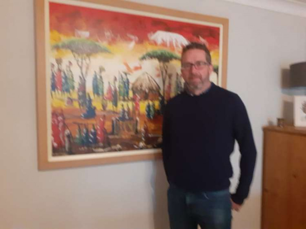 A  painting of a Kenyan village bought during a visit is a reminder of Colin's passion for the project