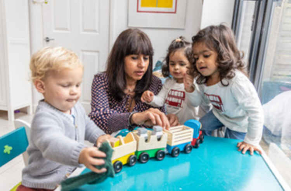 Bajaj's daughters and a friend playing with one of the toys. Photo Credit: John Sturrock