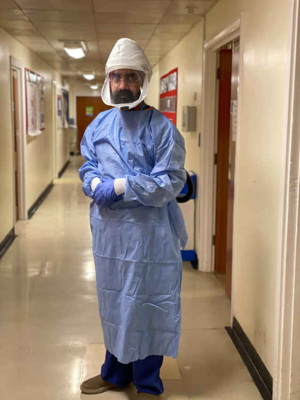 Dr Harmandeep Singh wearing his full PPE and respiratory hood at Ealing Hospital. Image Credit: Dr Harmandeep Singh