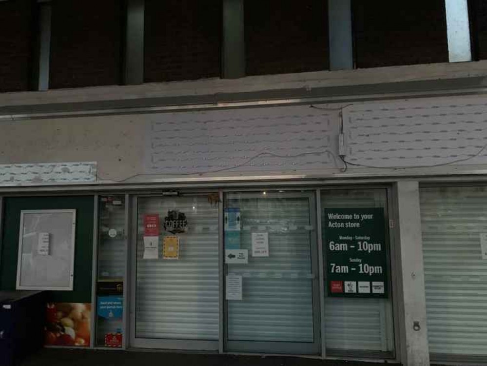 Signs had all been taken down and the store shutters had been pulled down