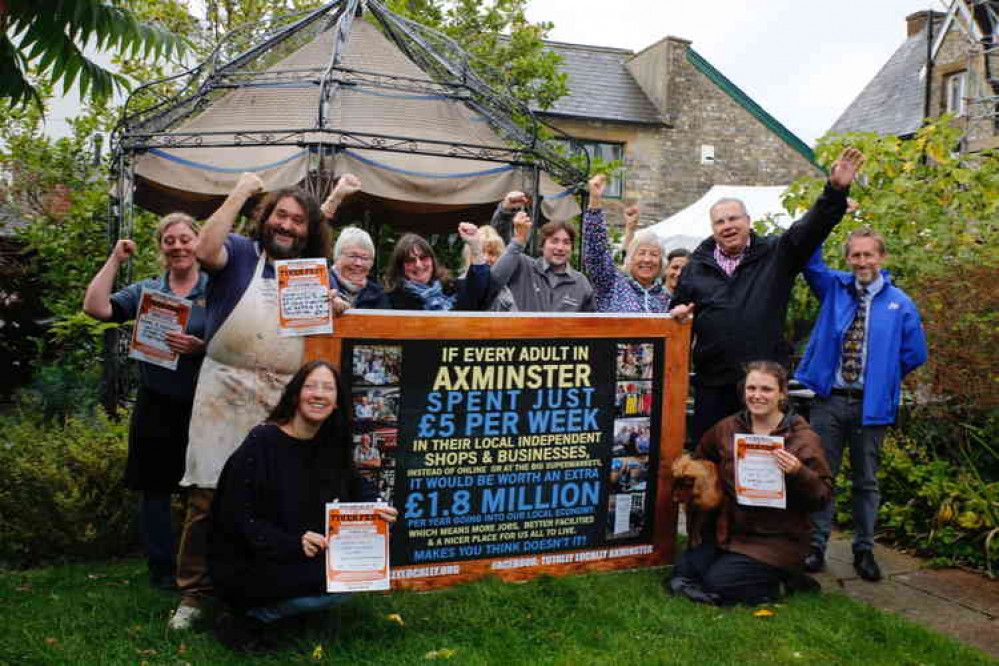 Totally Locally Axminster supporters celebrate when they launched a previous loyalty shopping initiative.