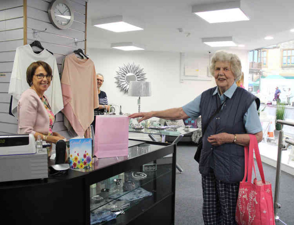 Louise Wall serves her first customer in Lou La Belle