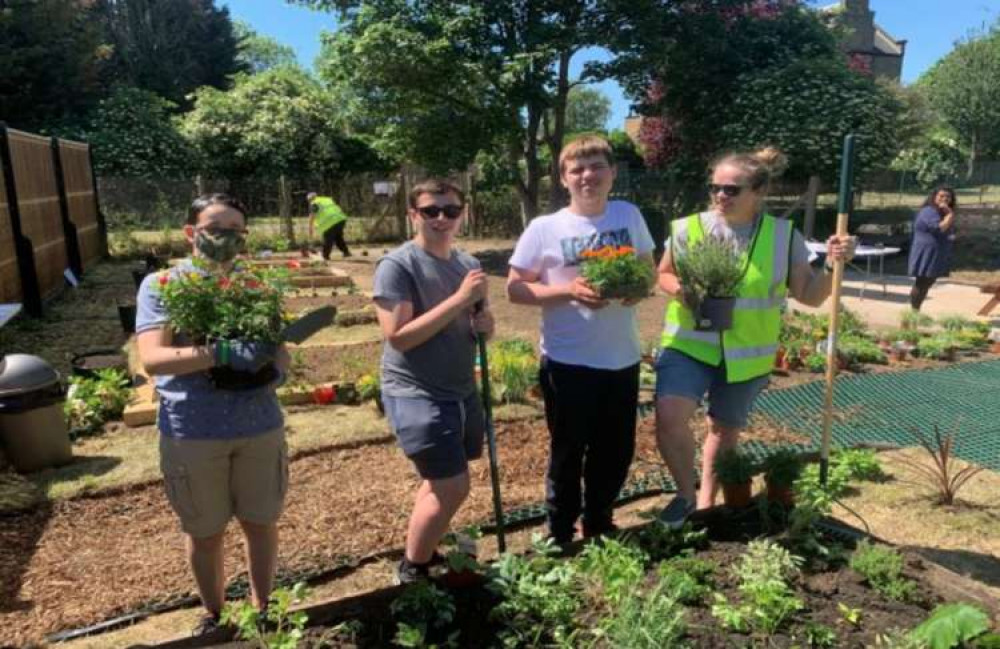 Students and staff also pitched in to help out. Image Credit: Ealing Council