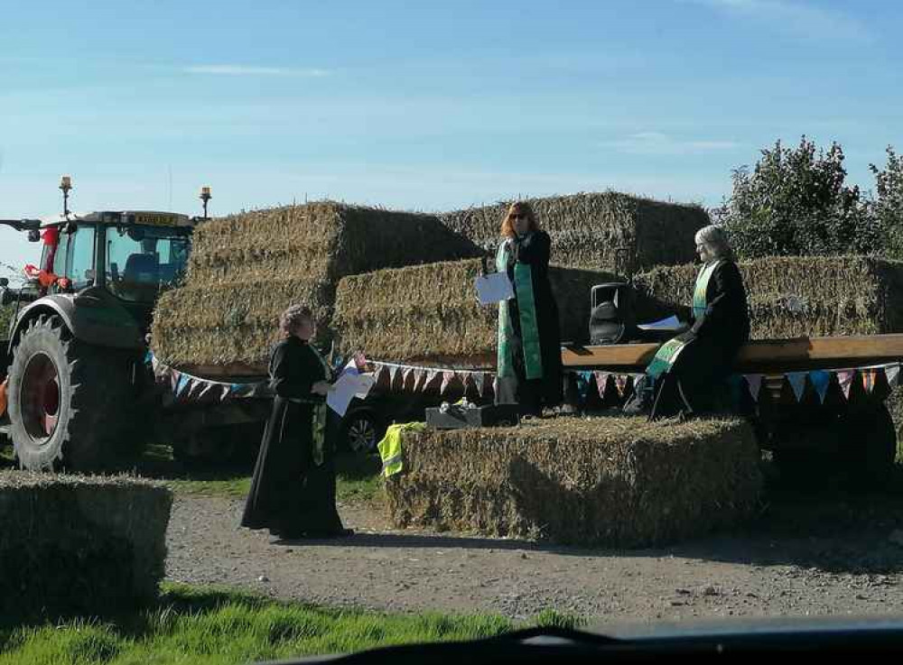 The Axe Valley Mission Community clergy conducting the drive-in Harvest festival