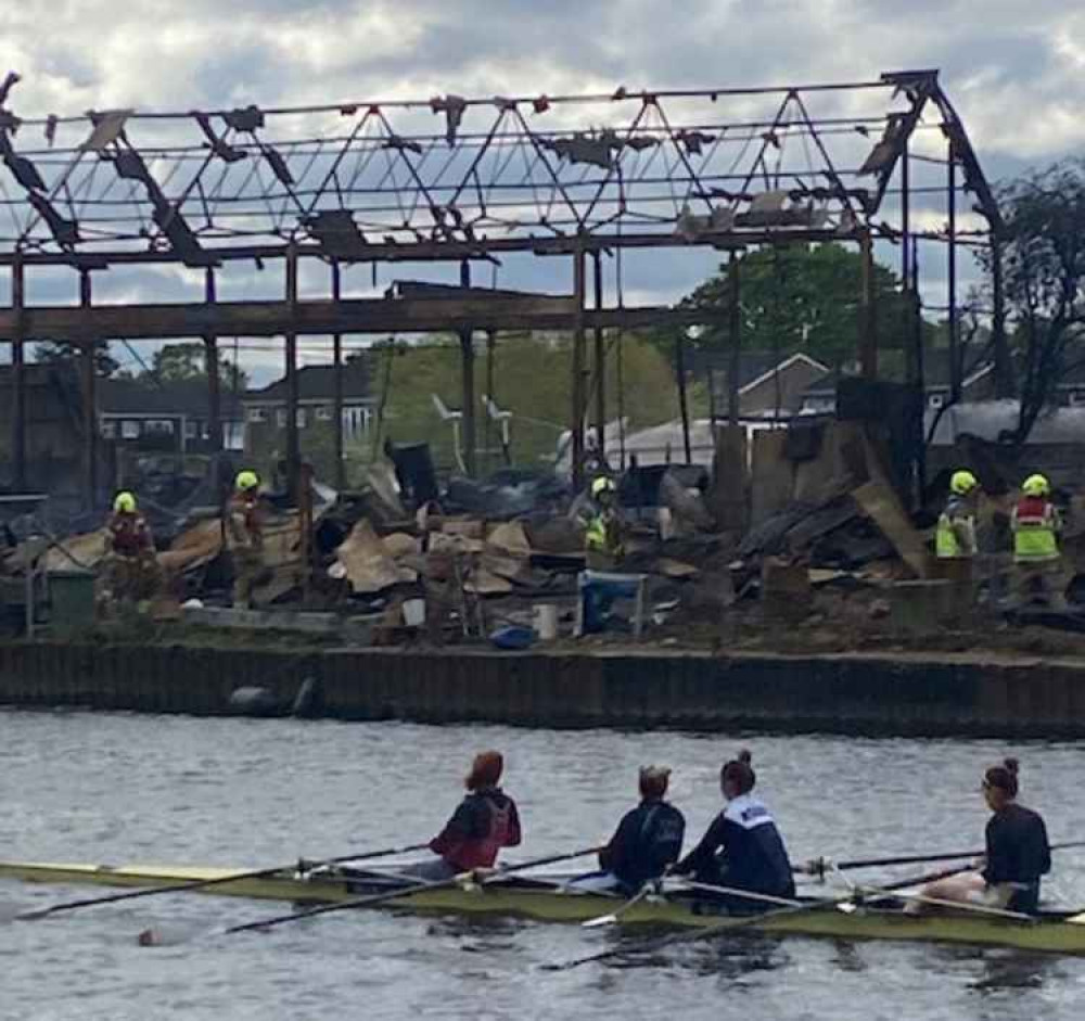 Rowers and firefighters survey the wreckage from the fire last night (Image: Stuart Higgins)