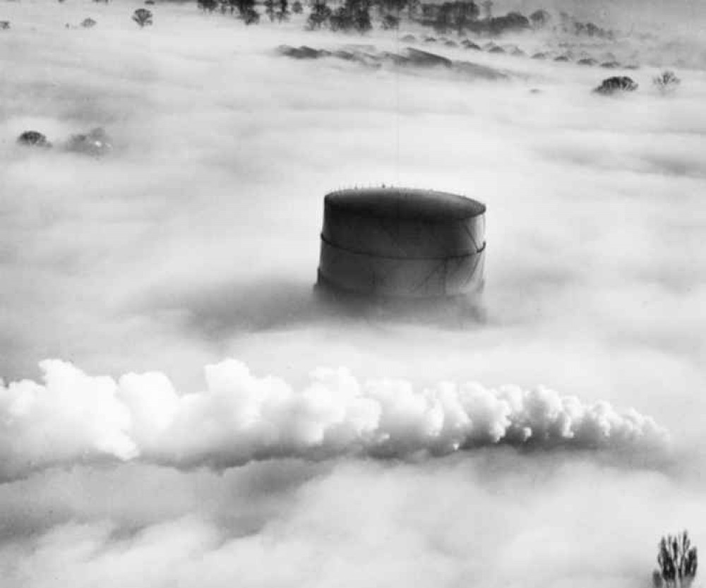 Five amazing pictures of Hitchin from the air. Stunning: Hitchin gasometer and the plume from a passing steam locomotive under fog taken in 1949