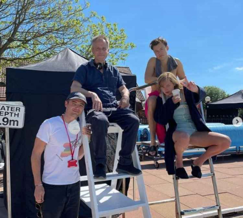 Emma Corrin, Styles, producer Robbie Rogers and director Michael Grandage - and the unmistakable sight of Hitchin Swimming Centre as we told you in our world exclusive last week. CREDIT: Emma Corrin Insta