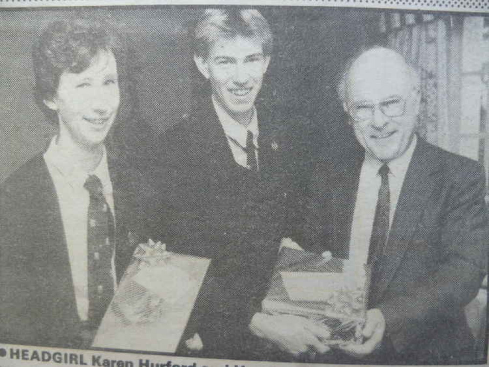 Colyton Grammar School – head boy Robert Moulding presenting a retirement gift to Ernest Fox Colyton Grammar School – head boy Robert Moulding presenting a retirement gift to Ernest Fox