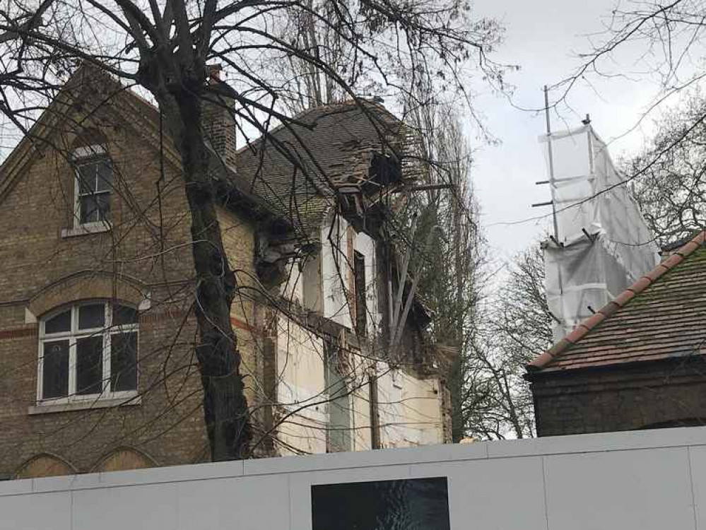 A former refuge next to the church is being demolished