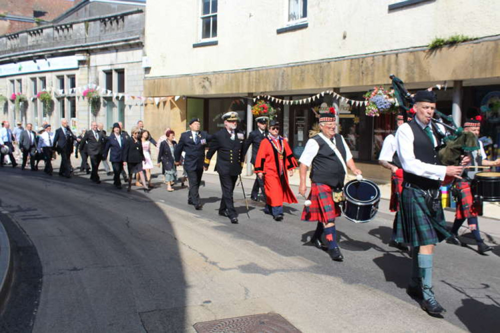 The Royal British Legion parade through Axminster town centre led by the Exmouth Pipe Band