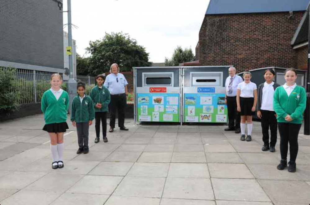 Cllr Guy Lambert (left) and Cllr Melvin Collins (right) with pupils from Green Dragon Primary School. Image Credit: Hounslow Council