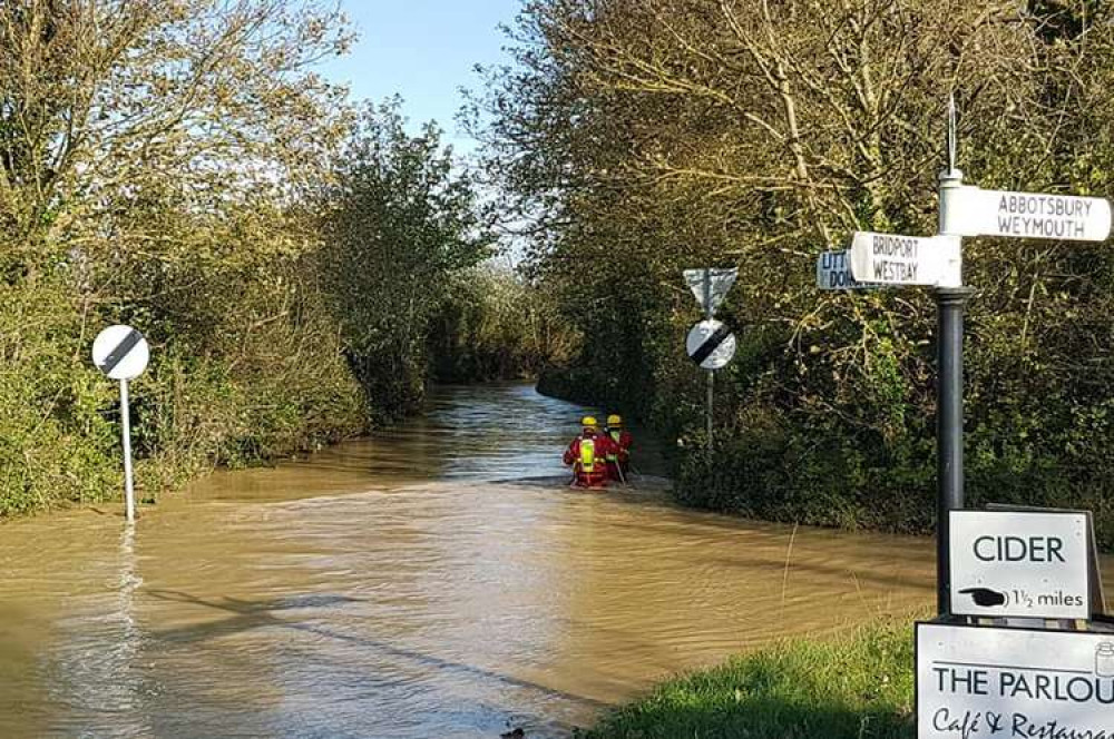 Members of Axminster few crew waded through the floodwater to try and reach the family