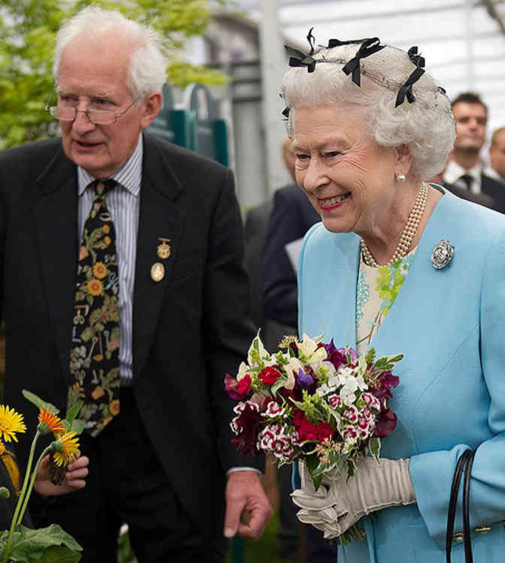 Award-winning gardening expert Peter Seabrook meets Her Majesty, The Queen, at the Chelsea Flower Show carrying a posy of flowers from his garden