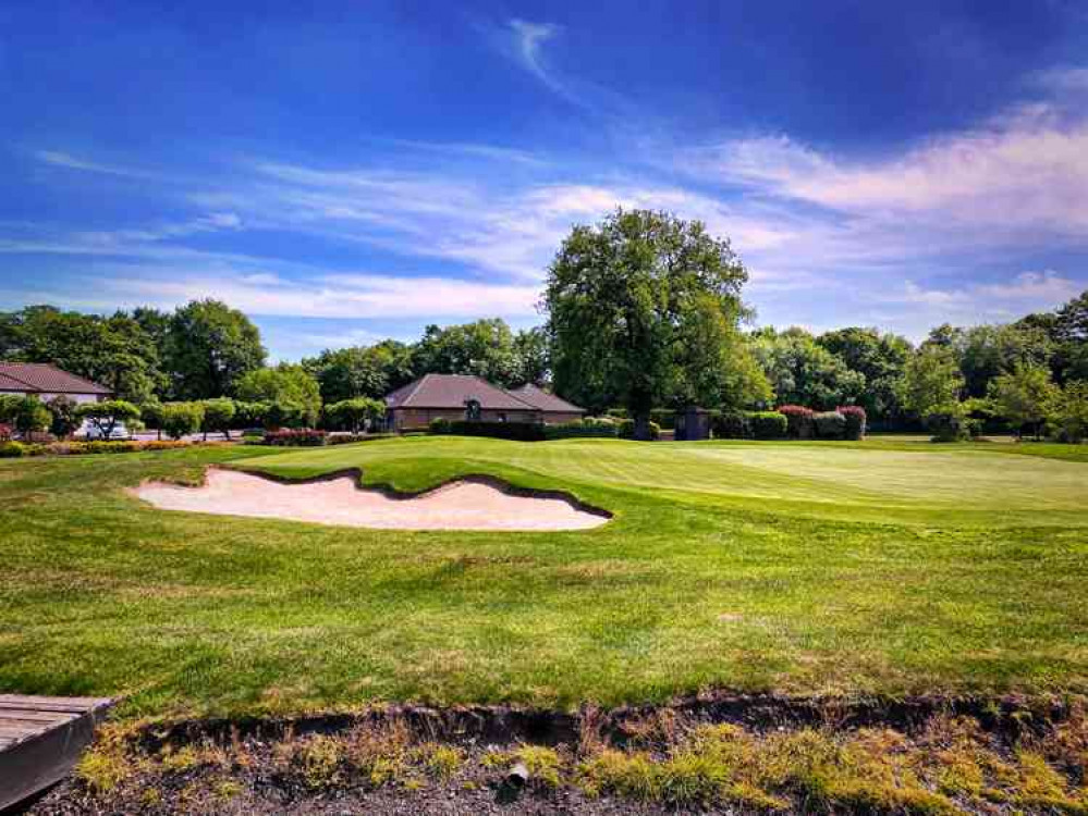 Players should smooth sand with feet and flagsticks to remain in the hole and must not be touched