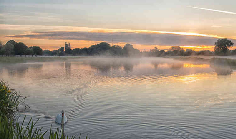 The mix of mist and clouds make this a beautiful sunrise in Home Park (Photo by Sue Lindenberg)