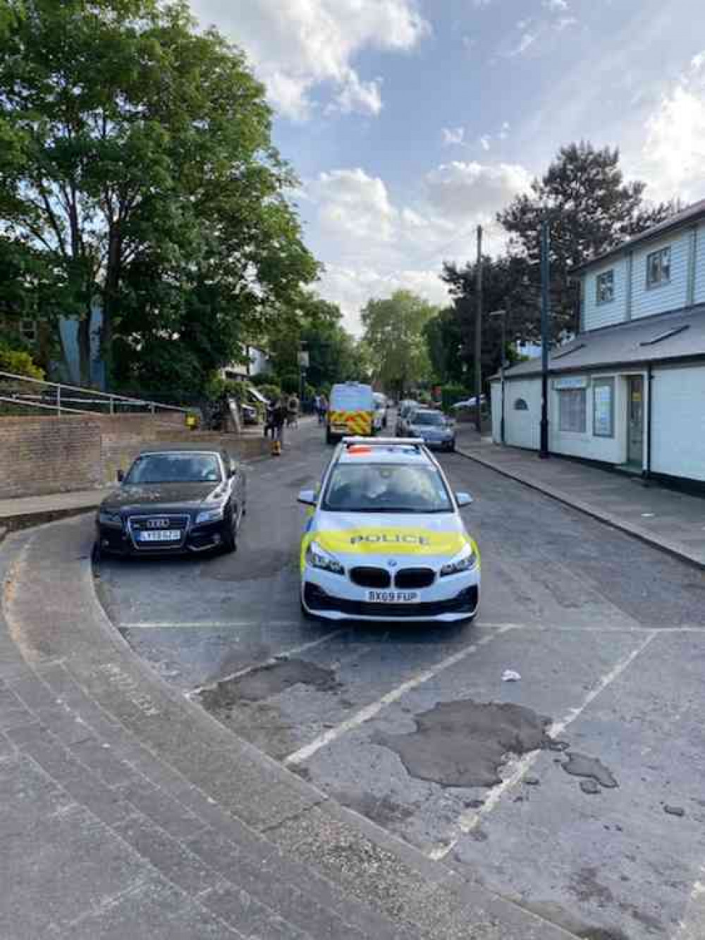 Police car and van in Ferry Road next to the Anglers Pub