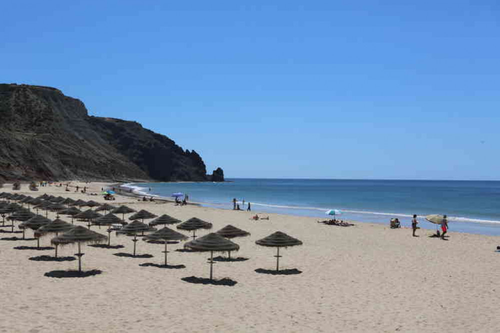 the beach was near deserted and those who chose to sunbathe were socially distanced on loungers placed 2m apart